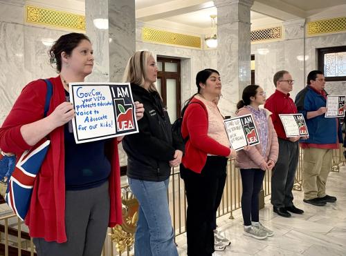 Teachers silently protest in front of Gov. Spencer Cox’s office and call on him to veto HB267 on Feb. 14, 2025. (Photo by Vanessa Hudson/Utah News Dispatch)