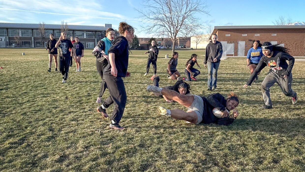 The girls on the Layton Christian Academy’s girls club rugby team practice drills at Barnes Park in Kaysville, Utah. Eseta Moala, the first receiver for the team, says tackling is her favorite part of the game.