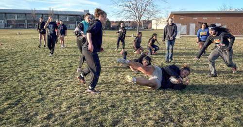 The girls on the Layton Christian Academy’s girls club rugby team practice drills at Barnes Park in Kaysville, Utah. Eseta Moala, the first receiver for the team, says tackling is her favorite part of the game.