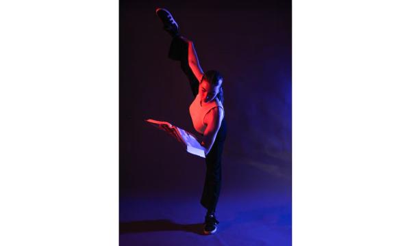 (Billie Martinez | Special to The Tribune) Dancer Gemma Leonard poses with a school book at Highland High School in Salt Lake City. The senior feels pressure to succeed and fills her time with homework, leadership and sports in order to get into college.