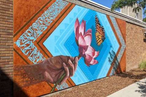 Luis Novoa, Alan Ochoa and Miguel Galaz — known together as Roots Art Kollective — completed a mural for the new Peace and Justice Garden at Salt Lake Community College's South City Campus. The artists are all SLCC alumni.(Jonny Tollestrup | Globeslcc.com) Luis Novoa, Alan Ochoa and Miguel Galaz — known together as Roots Art Kollective — completed a mural for the new Peace and Justice Garden at Salt Lake Community College's South City Campus. The artists are all SLCC alumni.