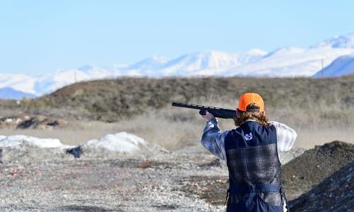 USU Shotgun Shooting Club member Chandler Wilson aims and shoots at a clay target